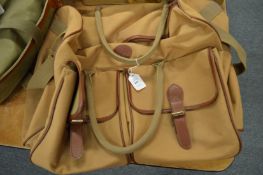 A canvas and leather holdall.