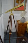 A good brass telescope on tripod base.