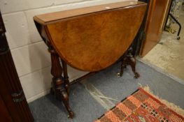 A Victorian figured walnut Sutherland table.