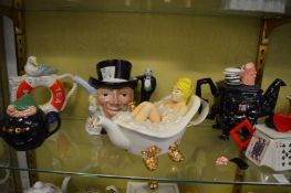 A collection of novelty teapots.