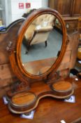A Victorian mahogany dressing table mirror with two small storage compartments.