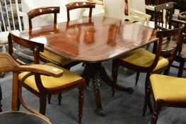 A Regency mahogany tilt-top breakfast table of rounded rectangular form on a turned column with four