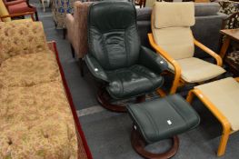 An Ekornes green leather swivel armchair and footstool.