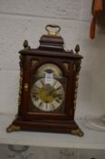 A Georgian style mantel clock.