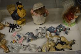 Miniature Disney whimsies and Beatrix Potter figures.
