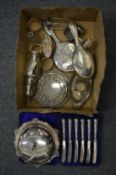 A quantity of silver items to include a muffin dish and cover.