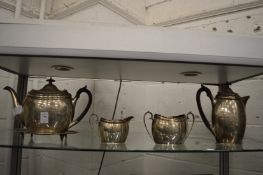 A silver five piece tea service, comprising teapot, hot water jug, sugar bowl, milk jug and teapot