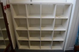 An Ikea Kallax room divider style bookcase or display shelves.