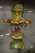 A decorative Continental porcelain potpourri vase and cover.