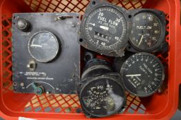 A group of aircraft gauges.