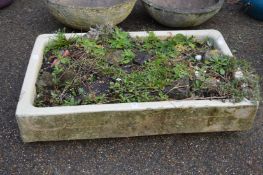 An old kitchen sink, as a planter.