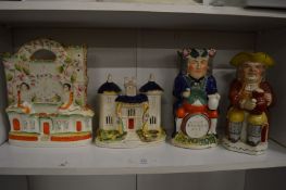 Two toby jugs and two Staffordshire flatback groups.