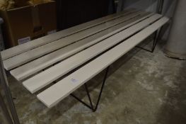 A slatted bench seat.