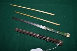 A cased chopstick and knife set.