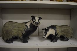 Two pottery badgers.