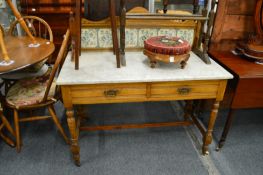 A Victorian ash washstand with marble top and tiled splash back.