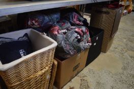 A linen basket, various linen, folding storage boxes etc.