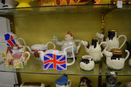 A collection of novelty teapots.