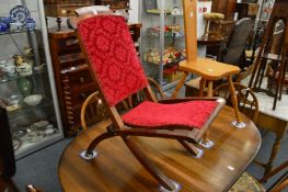 A Victorian mahogany folding chair.
