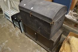 A dome topped trunk and an oak coffer.