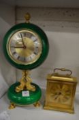 A decorative mantel clock and a Swiza carriage clock.