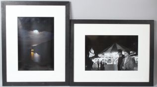 ATTRIBUTED TO ROGER DEAKINS Figures at a fairground black and white photographic print 26.5 x 40cm