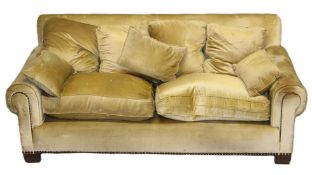 ANDREW MARTIN, A LARGE GOLD DRAYLON UPHOLSTERED TWO-SEATER SETTEE with brass studded decoration to