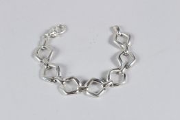 A HEAVY SILVER BRACELET.