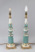 A PAIR OF DECORATIVE PORCELAIN TABLE LAMPS, with floral decoration, vase shaped bodies with fluted