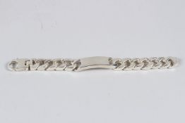 A HEAVY SILVER IDENTITY BRACELET with curb link chain.