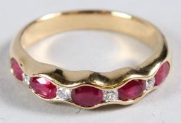 AN 18CT YELLOW GOLD, RUBY AND DIAMOND HALF HOOP RING.