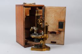 E. LEITZ, WETZLAR, A LATE 19TH CENTURY BRASS MICROSCOPE, No 42443, retailed by C, BAKER, 244 HIGH