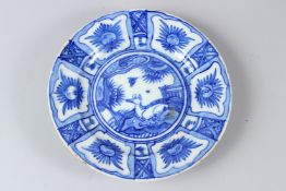 A FINE 17TH-18TH CENTURY PERSIAN SAFAVID GLAZED POTTERY DISH. 23.5cms diameter.