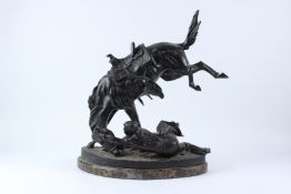 AFTER FREDERICK REMINGTON. A GOOD BRONZE GROUP OF A MAN DISMOUNTED FROM HIS BUCKING STALLION, signed