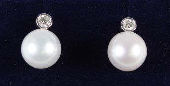 A PAIR OF 18CT WHITE GOLD, DIAMOND AND PEARL EAR STUDS.