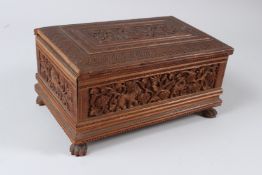A VERY FINELY CARVED 19TH CENTURY ANGLO INDIAN MAYSORE SANDALWOOD JEWELLERY BOX. 25cms x 16cms.
