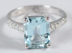 AN 18CT WHITE GOLD, DIAMOND AND AQUAMARINE RING.
