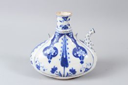 AN OTTOMAN TURKISH IZNIK POTTERY WATER FLASK, blue painted stylised decoration. 18cms high.