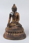 A GILT CHINESE BRONZE SHAKYAMUNI BUDDHA. 24.5cms high.
