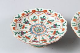 THREE 19TH CENTURY THAI MARKET CHINESE PEDESTAL DISHES. 12cms diameter.