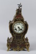 A 19TH CENTURY FRENCH BOULLE MANTLE CLOCK with enamel dial and ormolu mounts. 36cms high.