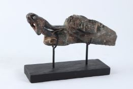 AN INDIAN CARVED GREEN HARDSTONE FIGURE, 19TH / 20TH CENTURY, modelled as the front end of a monkey.