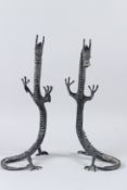 A PAIR OF CHINESE BRONZE DRAGONS, standing on their hind legs. 40cms high.