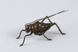 A JAPANESE OKIMONO BRONZE ARTICULATED GRASSHOPPER. 12cms.