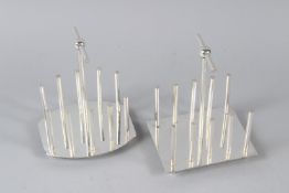 TWO CHRISTOPHER DRESSER STYLE TOAST RACKS. 13cms wide.