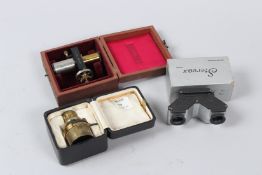 POWELL & LEALAND, A BRASS OPTICAL LENS, in a fitted leather case, retailed by F. PHILLIPS,