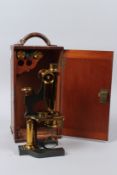 W. WATSON & SONS, 313 HIGH HOLBORN, LONDON, A BRASS MICROSCOPE, in a fitted mahogany case with