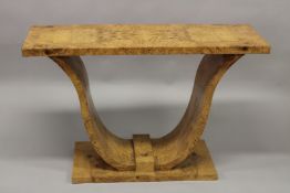 AN ART DECO STYLE BURR WOOD RECTANGULAR CONSOLE TABLE, with curving supports. 122cms long x 40cms