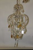 A SMALL VENETIAN STYLE CUT GLASS CHANDELIER. 45cms long x 27cms wide.