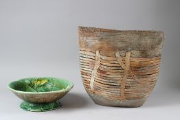 A STUDIO POTTERY BASKETWEAVE FORM VASE; together with a cabbage leaf bowl. Vase: 29cms high.